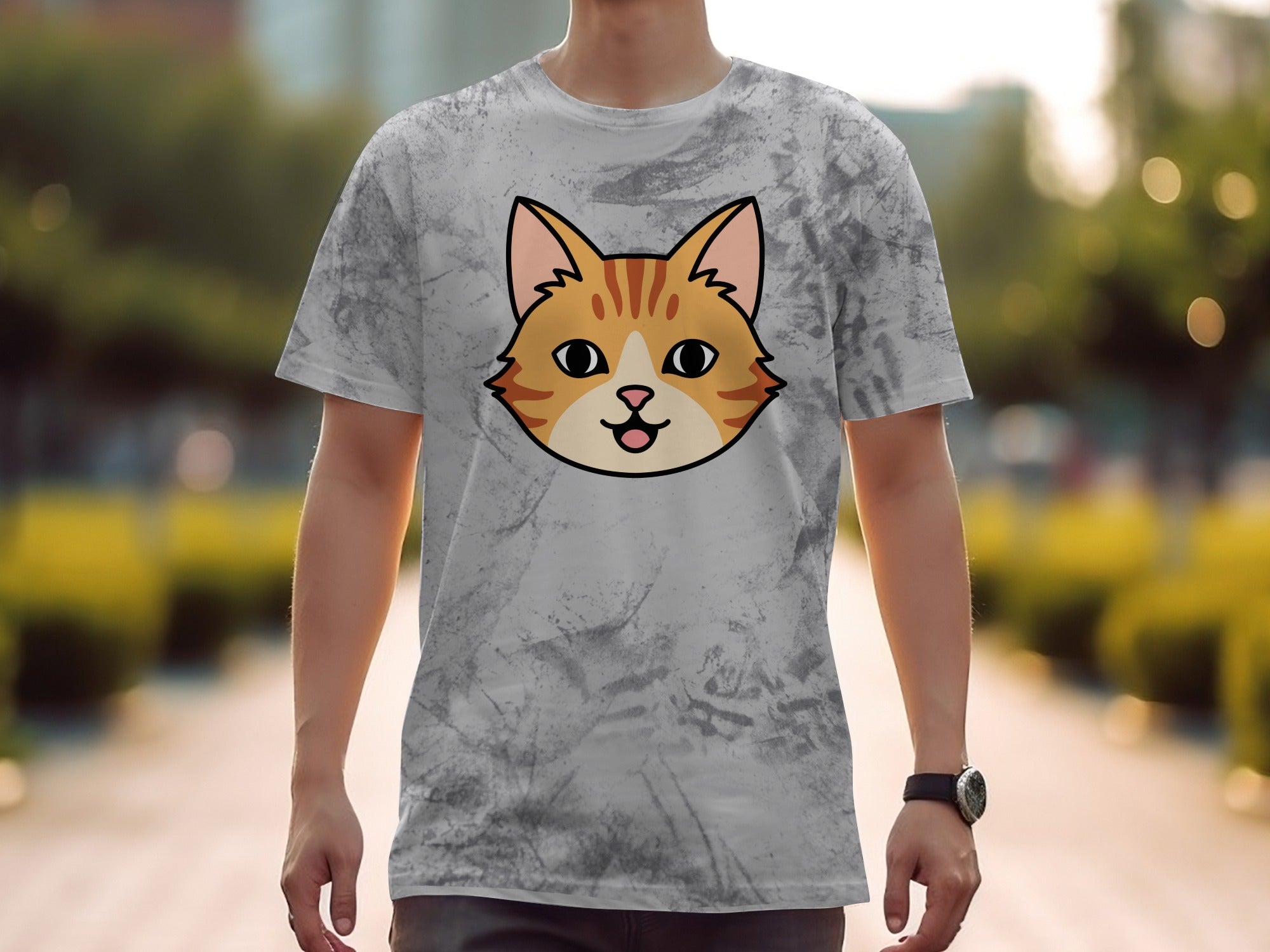 T-shirt with a stylized orange cat face design on a mottled gray background.
