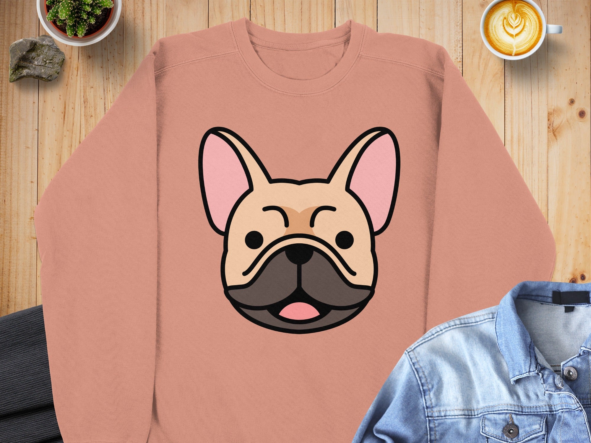 Peach sweatshirt with a cartoon French bulldog face.